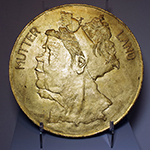 MUTTERLAND (Study For A Coin Head) 32.5cm diameter gilded 24 carat gold leaf